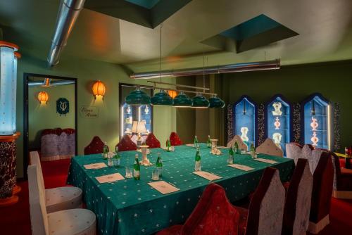 a table in a room with a green table cloth at Hotel Number Nine in Florence