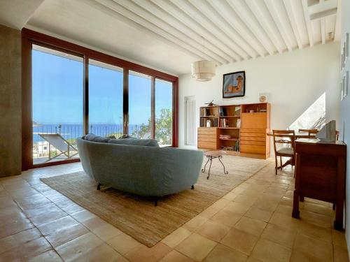 a large tub in a living room with a view of the ocean at Villa Ghezzi Sea View in Ischia