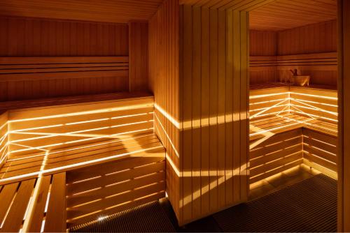 an empty sauna with the light shining on the wall at Hotel Number Nine in Florence