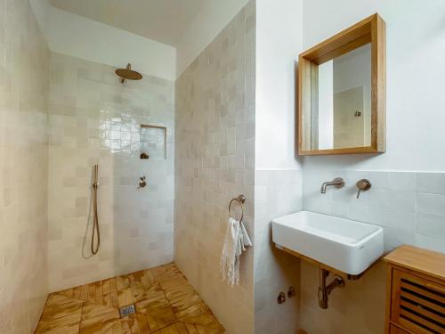 a bathroom with a sink and a mirror at Villa Ghezzi Sea View in Ischia