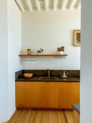 a kitchen with a sink and a counter at Villa Ghezzi Sea View in Casamicciola Terme