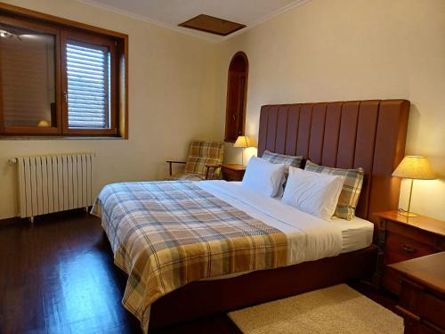 מיטה או מיטות בחדר ב-Casa Monte da Volta