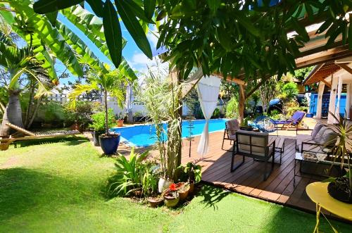 Φωτογραφία από το άλμπουμ του Ti case fleurie * Piscine * Jardin tropical σε Saint-Leu