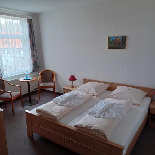 Una cama o camas en una habitación de Hotel Zittauer Hütte