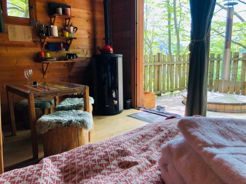 a room with a table and a table with a table at Là-Haut cabanes perchées in La Thuile