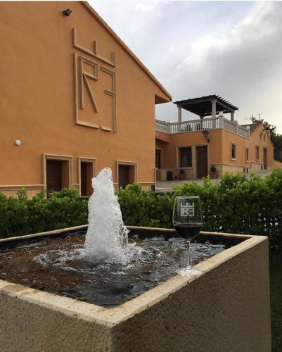 a water fountain in front of a building at El cerro de cabañeros in Retuerta de Bullaque
