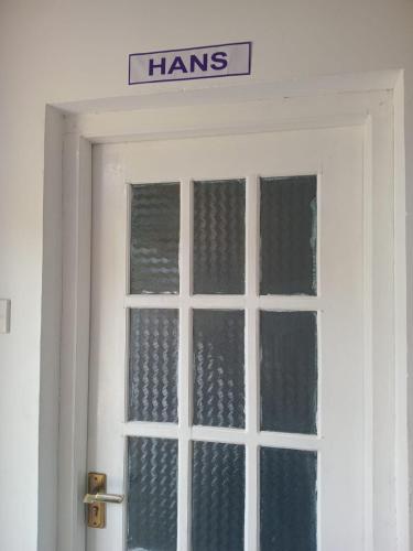a door with a sign on top of it at Frosty Heaven Guest House in Nuwara Eliya