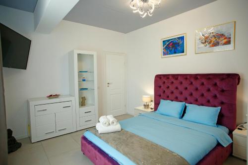 Postel nebo postele na pokoji v ubytování Kuda apartment - Promenada Mamaia Nord