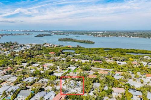 an aerial view of a city with a river and houses at Zachs Siesta Key Beach House Heated Saltwater Pool Pet Friendly in Siesta Key