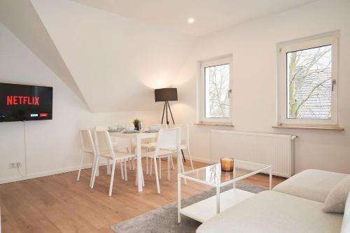 TV a/nebo společenská místnost v ubytování Juno Living - Witten Apartmenthaus