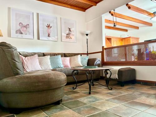 a living room with a couch and a table at La Gloria del Norte in Las Palmas de Gran Canaria