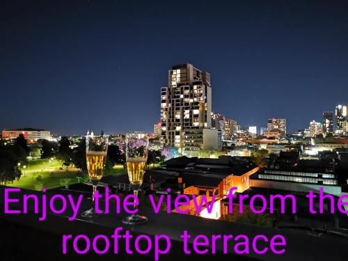 a view of a city skyline at night at King on Sturt in Adelaide