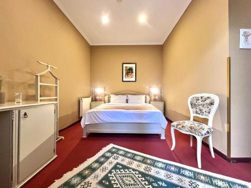 Voodi või voodid majutusasutuse Madera Hotel toas