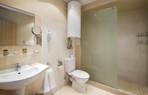 Et badeværelse på Sunrise All Suites Resort- All Inclusive