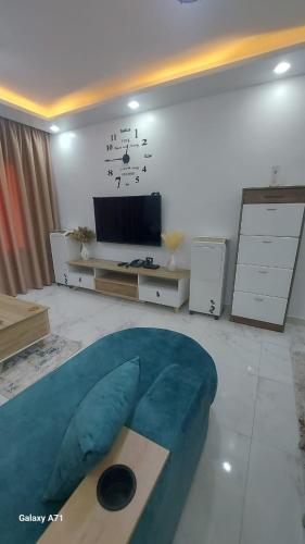 a living room with a large blue bean bag at Eamar tower 2 in Tanta
