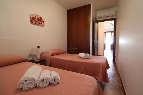 Katil atau katil-katil dalam bilik di casa Vincenzo