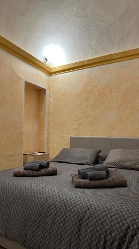 מיטה או מיטות בחדר ב-La Grotta dell'Orso
