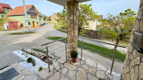 a view of a street from the balcony of a house at Villa Popice s výhledem na Pálavu in Poppitz