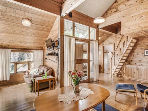 a living room with wood paneling and a staircase at Holiday Home Veganeset I - FJS294 by Interhome in Balestrand