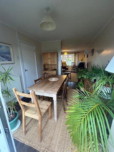 a living room with a wooden table and chairs at Number 10 in Chepstow