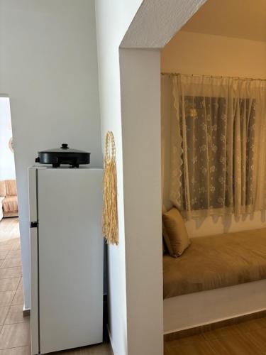 a bedroom with a bed in a room with a window at Marena 2 in Makry Gialos