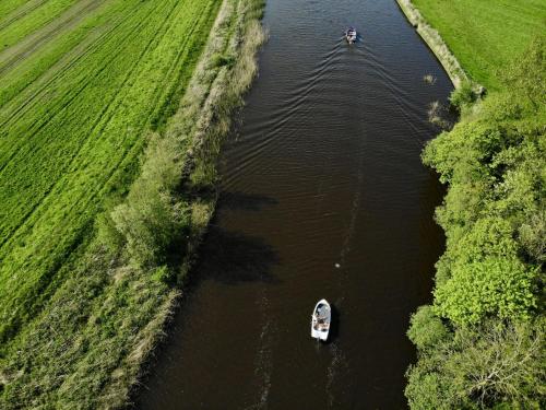 an aerial view of two boats in a river at Holiday Home Harboursuite Woudsend incl- motorboot by Interhome in Woudsend