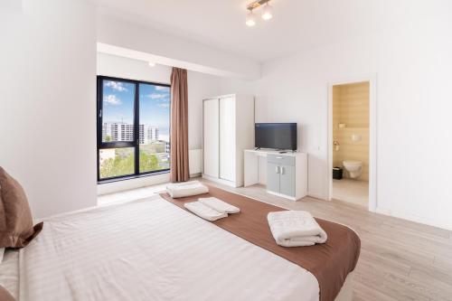Ένα ή περισσότερα κρεβάτια σε δωμάτιο στο Miramare Residence Aparthotel