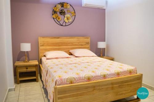 Postel nebo postele na pokoji v ubytování Villa Noëlyne