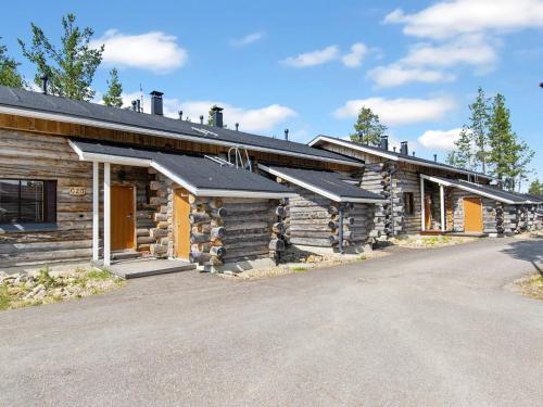 a log cabin with a driveway in front of it at Holiday Home Nilikuru g18 by Interhome in Saariselka
