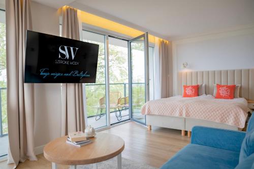 Postel nebo postele na pokoji v ubytování Hotel Szerokie Wody Sea & Sand Ustka