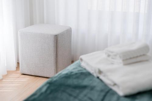 a room with a bed and a white mattress and aermottermott at Villa Stay Luxury Property Ponte De Lima in Ponte de Lima