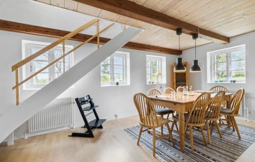 a dining room with a table and chairs at 2 Bedroom Beautiful Apartment In Kolind in Kolind