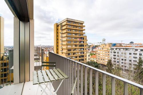 a balcony with a bench on a building at GuestReady - Central Park in Porto in Porto