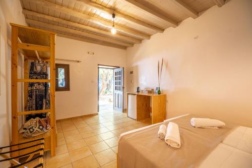 a large room with a bed and a hallway at Mylos Seaside Experience in Frangokastello