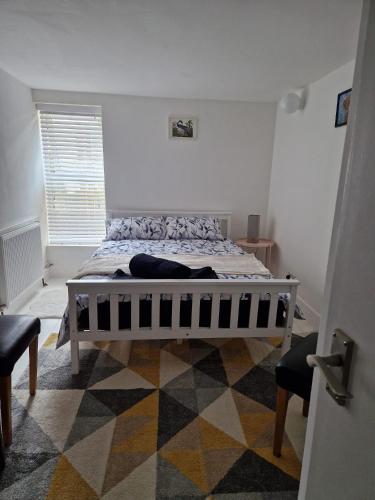 a bedroom with a large bed in a room at Seaside Haven Coastal Comfort 200m from the Beach in Kent
