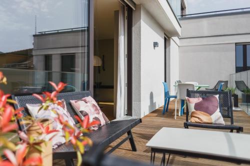 a balcony with two chairs and a table at The Circus Apartments in Berlin