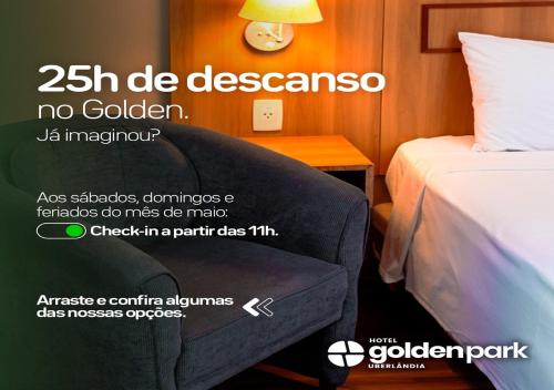 póster para una habitación de hotel con cama y silla en Hotel Golden Park Uberlandia en Uberlândia