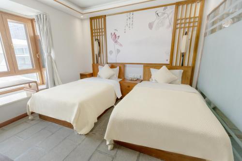 Postel nebo postele na pokoji v ubytování Dali Dare Sea View Gueshouse