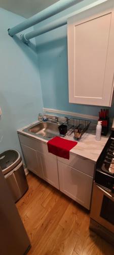 a kitchen with a sink and a counter top at Private 1 Bedroom in Boston in Boston