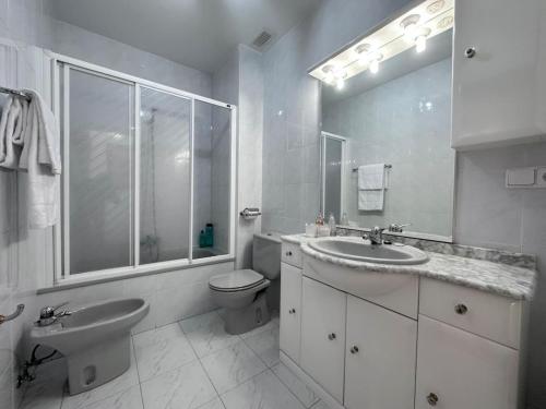 a white bathroom with a sink and a toilet at Betula Pendula - 12601 in Ajo