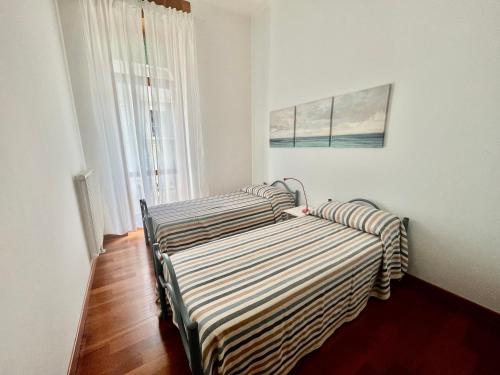 Postel nebo postele na pokoji v ubytování Condominio Fari