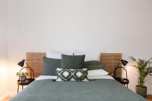 a bedroom with a bed with a pillow on it at The Green Door-Karri retreat in Margaret River Town