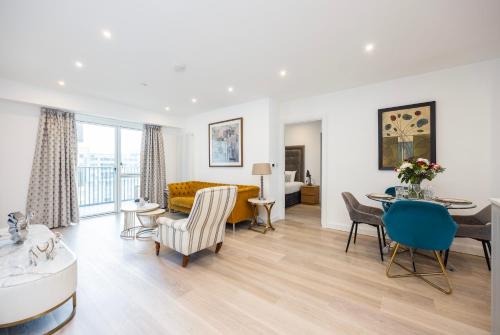 a living room with a couch and a table at Austin David Executive ExCeL in London