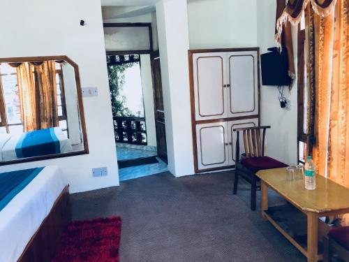 TV a/nebo společenská místnost v ubytování Sanmiro Lodge