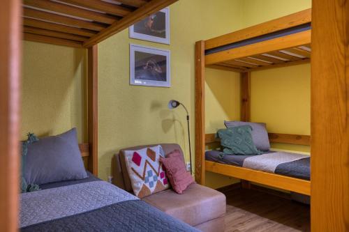 a bedroom with two bunk beds and a lamp at FAUNAPARK Lipová-lázně in Lipova Lazne