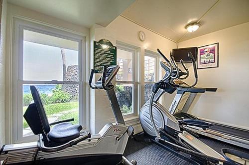 a gym with two exercise bikes in a room at Kona Makai 3-203 in Kailua-Kona