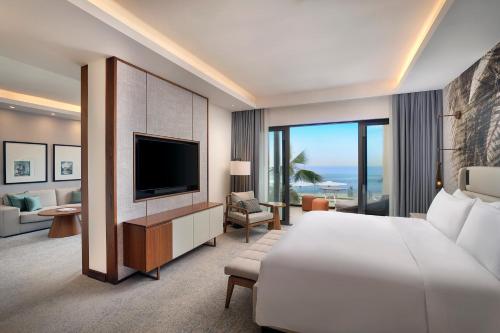 a hotel room with a bed and a television at Conrad Rabat Arzana in Rabat