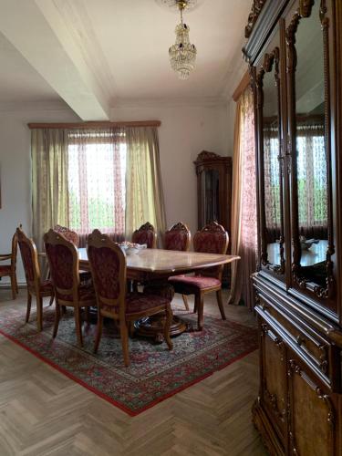 a dining room with a table and chairs at Hotel Villa DavidL in Sagarejo