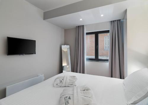 Postel nebo postele na pokoji v ubytování Le Vert Suites Platres