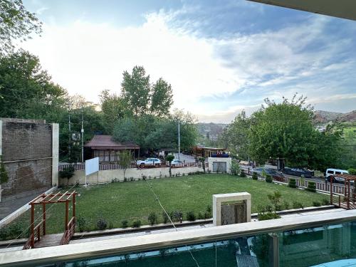 a view of a yard with a swimming pool at Blue Marine Shaqlawa in Erbil